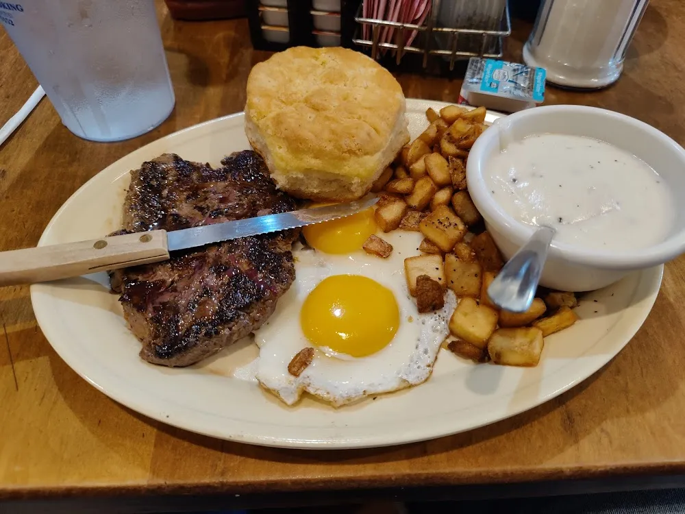 Eggs with 6 Oz Rib Eye Pork Chop or Chicken Fried Steak